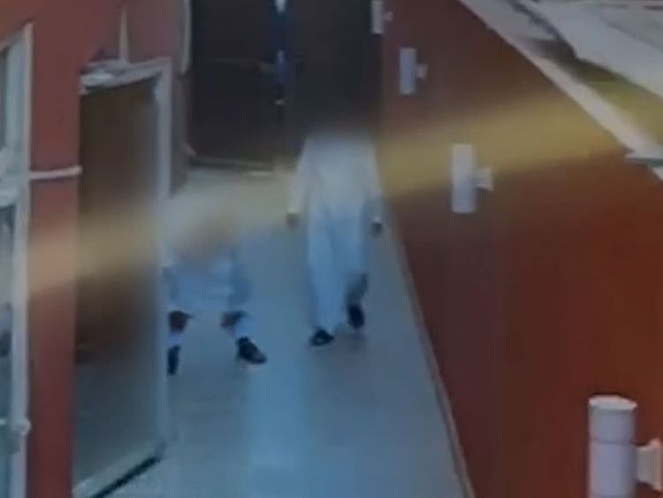 The footage shows the three walking barefoot into the house and later leaving with pairs of shoes apparently after failing to lay hands on pricier items.