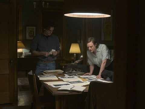 This image released by Apple TV+ shows Wagner Moura, left, and Elisabeth Moss in “Shining Girls”.