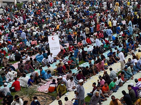 Workers having Iftar at a park in Sajaa industrial area in Sharjah. The iftar was organised by Team iftar. 