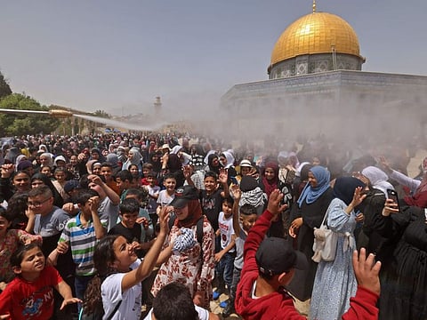 Palestinian worshippers attend the last Friday prayers of Ramadan at the Al Aqsa mosque compound on April 29, 2022. 
