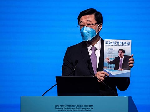 Hong Kong's former chief secretary John Lee introduces his election manifesto at an event in Hong Kong on April 29, 2022.
