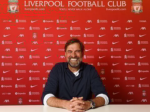 All smiles! Jurgen Klopp will remain as Liverpool coach until at least 2026.