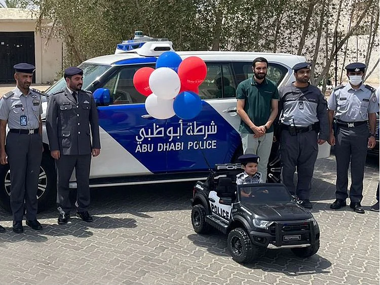 Abu Dhabi Police gift toy car to Emirati boy with terminal illness