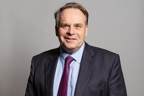 An undated handout photograph released by the UK Parliament shows Conservative MP for Tiverton and Honiton, Neil Parish, posing for an official portrait photograph at the Houses of Parliament in London.  