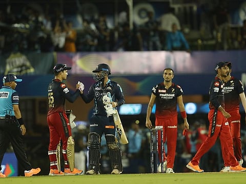 Gujarat and Bangalore players shake hands after match 43 of the TATA Indian Premier League 2022 (IPL season 15) at the Brabourne Stadium (CCI) in Mumbai.