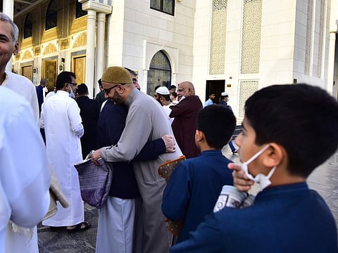 People greet each other at Al Farooq Omar Bin Al Khattab Mosque in Dubai on Eid Al Fitr, after the morning prayers today. 