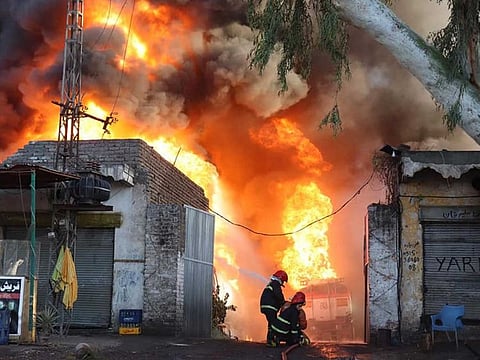 Rescue 1122 battles the oil depot fire at the Tarujaba oil depot in the Nowshera district of Khyber Pakhtunkhwa province.