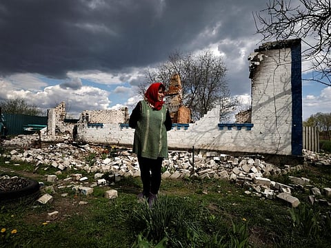 Lyubov Lenko, 61, shows her house that according to her was destroyed by shelling in Budy, Chernihiv region, Ukraine, on May 3, 2022.  