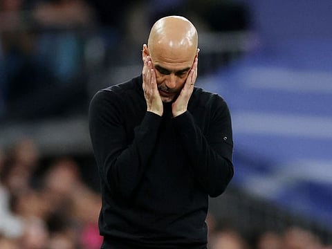 Lost again... Manchester City manager Pep Guardiola reacts to the defeat against Real Madrid at the Santiago Bernabeu, Madrid, Spain.