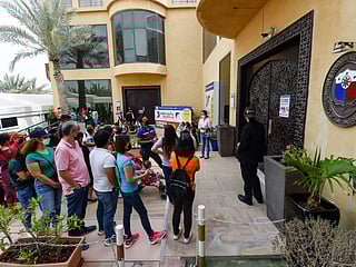 Overseas Filipinos wait to cast their vote at the Philippine consulate in Dubai