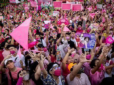 Supporters of Philippine Vice President and presidential candidate Leni Robredo cheer during a campaign rally in Pasay City, Metro Manila, Philippines, April 23, 2022.