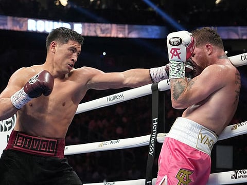 Dimitry Bivol (left) lands a left on Canelo Alvarez during their light heavyweight championship bout at T-Mobile Arena in Las Vegas, Nevada, on Saturday.