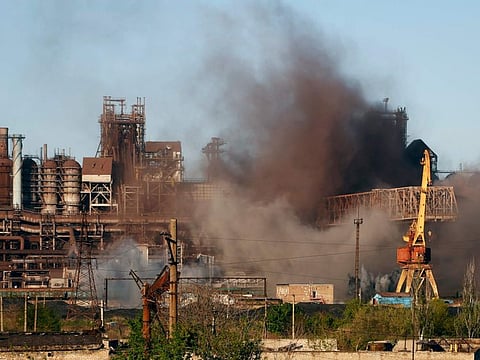 Smoke rises from the Metallurgical Combine Azovstal in Mariupol during shelling, in Mariupol, in territory under the government of the Donetsk People's Republic, eastern Ukraine, Saturday, May 7, 2022.