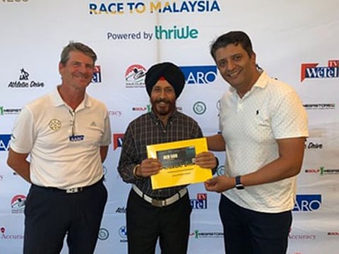 Gurbax Singh (18), winner of Division 4 of the Dubai Hills Golf Club Qualifying Round of the UAE Emirates NBD Race to Malaysia, with representatives from the organisers and sponsors.