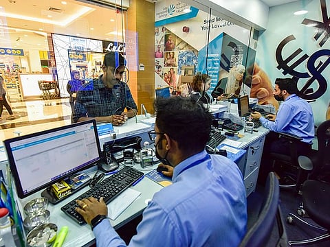 Customers at Lulu Exchange in Sharjah. The total value of remittances has been increasing steadily over the past decade.