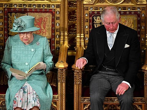 Britain's Prince Charles, Prince of Wales, with Britain's Queen Elizabeth II as she delivers the Queen's Speech on the The Sovereign's Throne in the House of Lords chamber, during the State Opening of Parliament in the Houses of Parliament in London on December 19, 2019 . Prince Charles will replace his 96-year-old mother Queen Elizabeth II at Tuesday's ceremonial opening of the UK parliament, Buckingham Palace said May 9, 2022, citing the monarch's ongoing mobility issues.  
