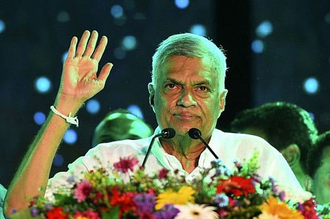 United National Party (UNP) party leader Ranil Wickremesinghe waves to supporters in a file photo.