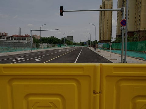 A general view shows a fence before a residential area under lockdown in Beijing on May 12, 2022. 