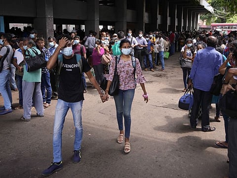 Stranded Sri Lankans wait for bus transport during a relaxation in a nationwide curfew in Colombo, Sri Lanka on May 12, 2022. 