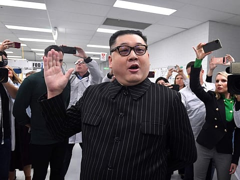 A man dressed as North Korea’s leader Kim Jong-Un arrives as Prime Minister Scott Morrison leaves Extel Technologies manufacturing facility on Day 33 of the 2022 federal election campaign, in Melbourne, in the seat of Chisholm. Friday, May 13, 2022.