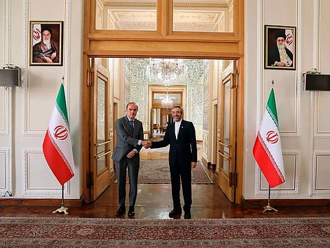 Enrique Mora, left, during his meeting with Iran's top nuclear negotiator Ali Bagheri Kan in Tehran on May 11, 2022.  