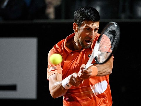 Serbia's Novak Djokovic returns to Canada's Felix Auger-Aliassime during their quarter finals match at the ATP Rome Open tennis tournament at Foro Italico in Rome. 