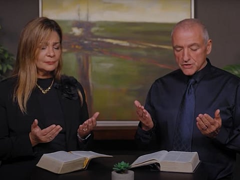 Sona Kazajian, International Ministries coordinator, and Pastor Ray Galea of Fellowship Dubai pray for late Sheikh Khalifa bin Zayed Al Nahyan.