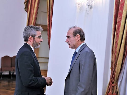 Enrique Mora, right, speaks with Iran's top nuclear negotiator Ali Bagheri Kani, in Tehran, on May 11, 2022. 