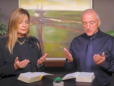 Sona Kazajian, International Ministries coordinator, and Pastor Ray Galea of Fellowship Dubai pray for late Sheikh Khalifa bin Zayed Al Nahyan.