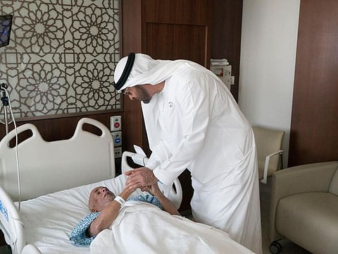 Sheikh Mohamed bin Zayed visits Komukutty at his hospital bed.