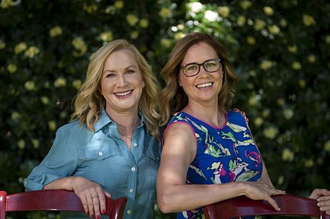 Angela Kinsey and Jenna Fischer pose for photos in Glendale, California.