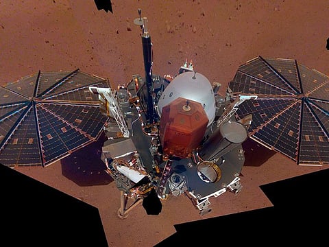 This Dec. 6, 2018 image made available by NASA shows the InSight lander. The scene was assembled from 11 photos taken using its robotic arm.