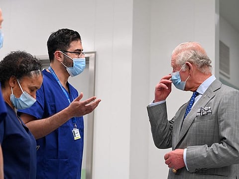 Britain's Prince Charles, Prince of Wales meets with members of the medical team as part of his visit of the new Derwent operating theatre at the Royal Bournemouth Hospital, in Bournemouth, South England, on May 6, 2022. Overall nursing staff numbers have increased to 758,300 but a rising number of people are also leaving the register, 27,133 over the last year, 13 per cent more than the year before, the NMC said.