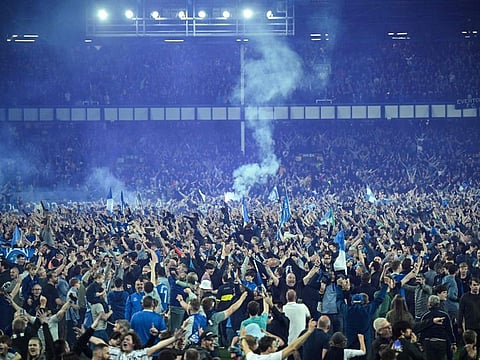 Everton's fans invade the pitch to celebrate at the end of the English Premier League match against Crystal Palace at Goodison Park in Liverpool, north west England. Everton staged a dramatic fightback from two goals down to preserve their Premier League status with a 3-2 win.