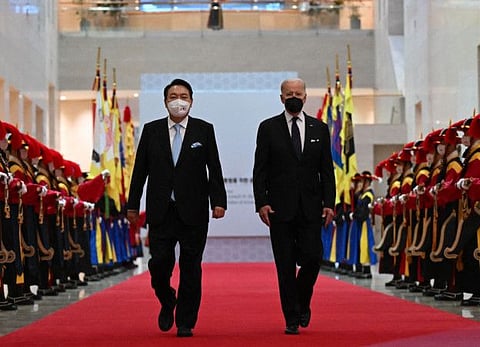 South Korean President Yoon Suk-yeol and US President Joe Biden arrive for a state dinner at the National Museum of Korea in Seoul on May 21, 2022. 