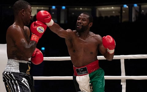 Floyd Mayweather (right) fights with Don Moore during the Abu Dhabi Unity Boxing event at the Etihad Arena in Abu Dhabi.