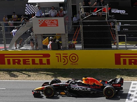 Red Bull's Dutch driver Max Verstappen crosses the finish line in first place during the Spanish Formula One Grand Prix at the Circuit de Catalunya in Montmelo, on the outskirts of Barcelona.