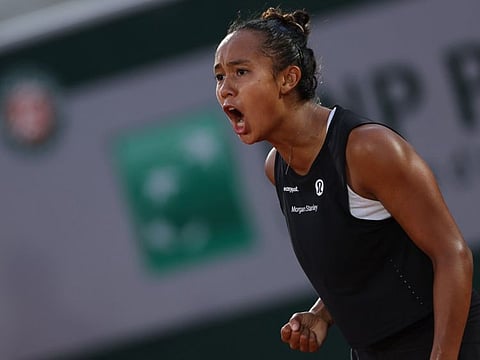 Canada's Leylah Fernandez reacts during her women's singles match against France's Kristina Mladenovic on day one of the Roland-Garros Open tennis tournament at the Court Suzanne-Lenglen in Paris.