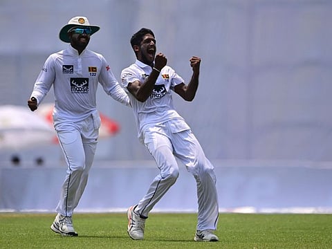 Sri Lanka's Kasun Rajitha (right) celebrates after taking the wicket of Bangladesh's Mosaddek Hossain during the second day of the second Test at the Sher-e-Bangla National Cricket Stadium in Dhaka on Tuesday.