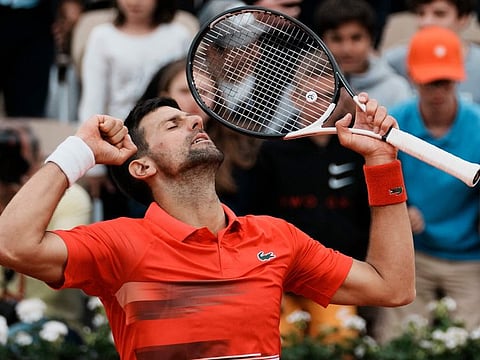 Serbia's Novak Djokovic reacts as he defeats Slovakia's Alex Molcan during their second round match of the French Open tennis tournament at the Roland Garros stadium in Paris. Djokovic won 6-2, 6-3, 7-6 (7-4).