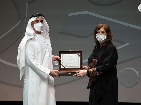 Emirati poet and writer Maisoon Saqer receiving the Sheikh Zayed Book Award for Literature for her 2021 novel.