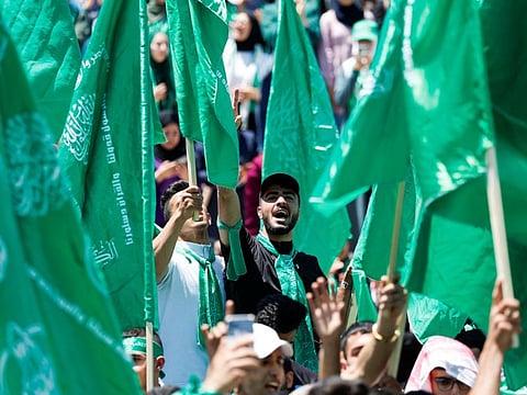 Palestinians take part in a rally celebrating Hamas winning students council election in Birzeit University, near Ramallah. Hamas rules the Gaza Strip and is deemed a terrorist group in the West and by Israel.