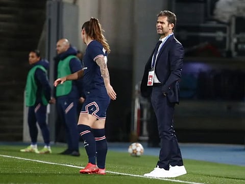 Paris St-Germain women's manager Didier Olle-Nicolle (right) has been suspended following allegations of "inappropriate behaviour".
