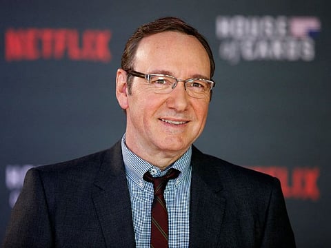 In this file photo taken on February 26, 2015 US actor Kevin Spacey poses for photographers on the red carpet ahead of the world premiere of the television series 'House of Cards - Season 3 Episode 1' in London.