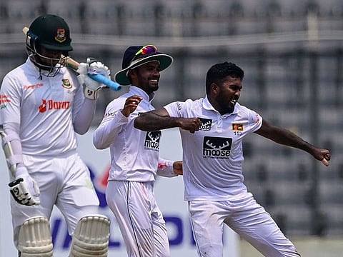 Sri Lanka's Asitha Fernando (right) reacts after the dismissing Bangladesh's Shakib Al Hasan during the final day of the second Test in Dhaka on Friday.