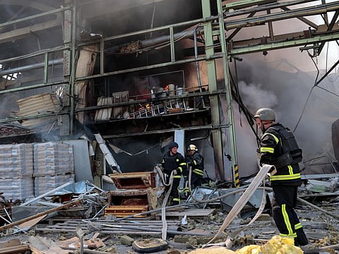 Rescuers work at a site of an industrial building damaged by a Russian military strike, as Russia's attack on Ukraine continues, in the town of Bakhmut, in Donetsk region, Ukraine May 27, 2022.