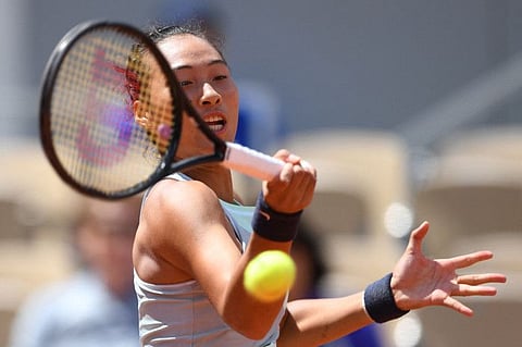 China's Zheng Qinwen will play world number one Iga Swiatek tomorrow for a place in the quarter-finals of the French Open.