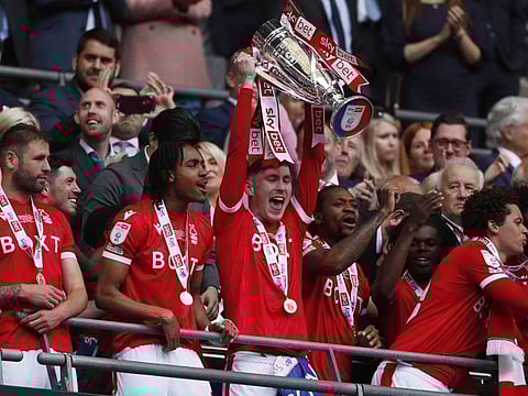 Nottingham Forest's James Garner celebrates with the trophy after winning the Championship Play-Off Final against Huddersfield at Wembley.