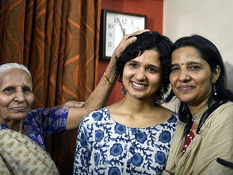 St Stephen's alumnus Shruti Sharma with family members after she topped the Union Public Service Commission (UPSC) Civil Services exam 2021, at her residence, in New Delhi on Monday, May 30, 2022.