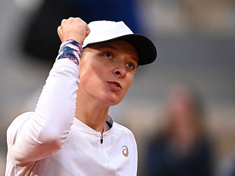 Poland's Iga Swiatek celebrates after winning her fourth round match against  China's Qinwen Zheng.